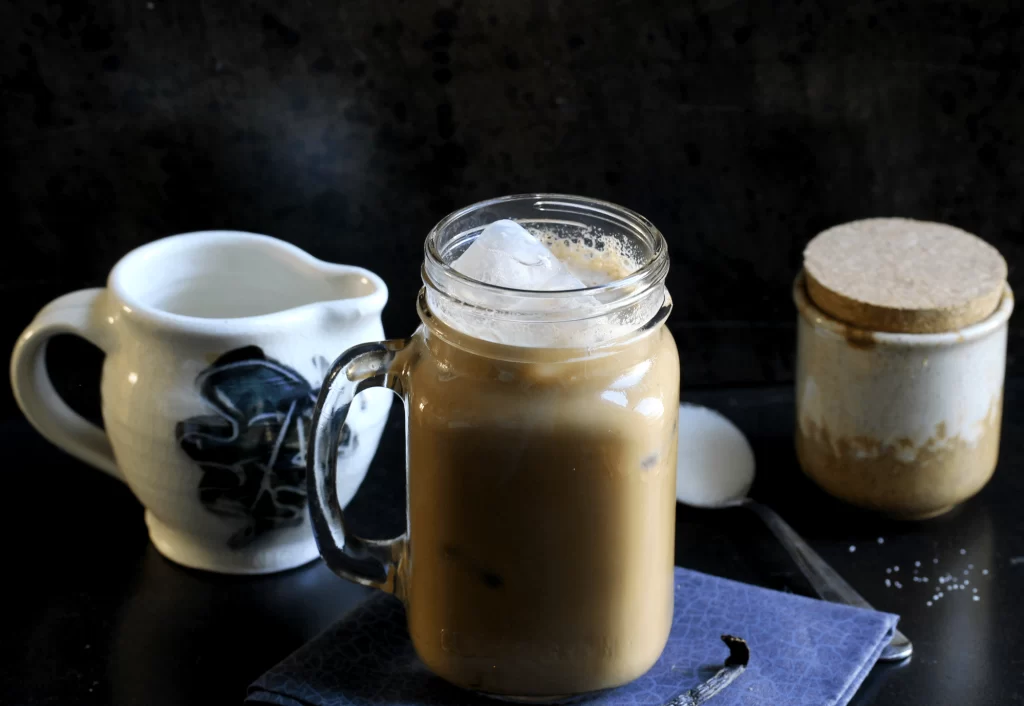 Icde blonde vanilla latte in ajar with ice cubes on the top