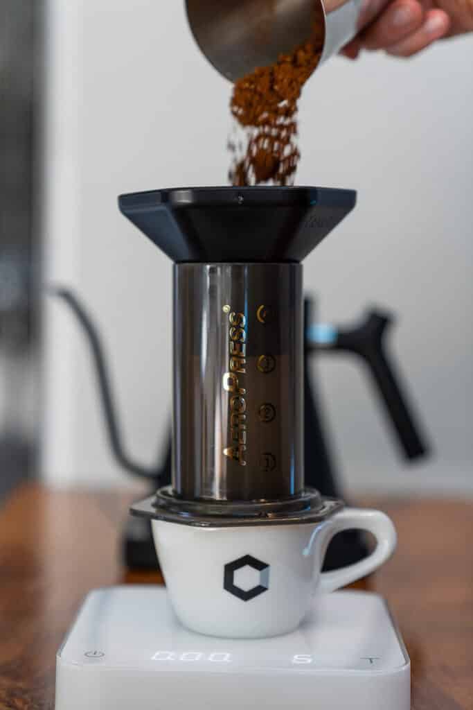 espresso coffee in making on an aeropress machine