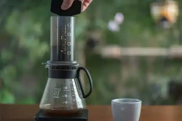 a person making coffee using an aeropress machine