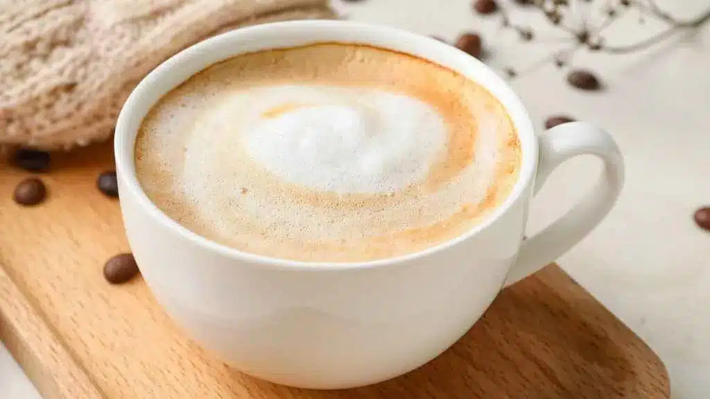 Cup Of Hot Cappuccino Coffee On Table