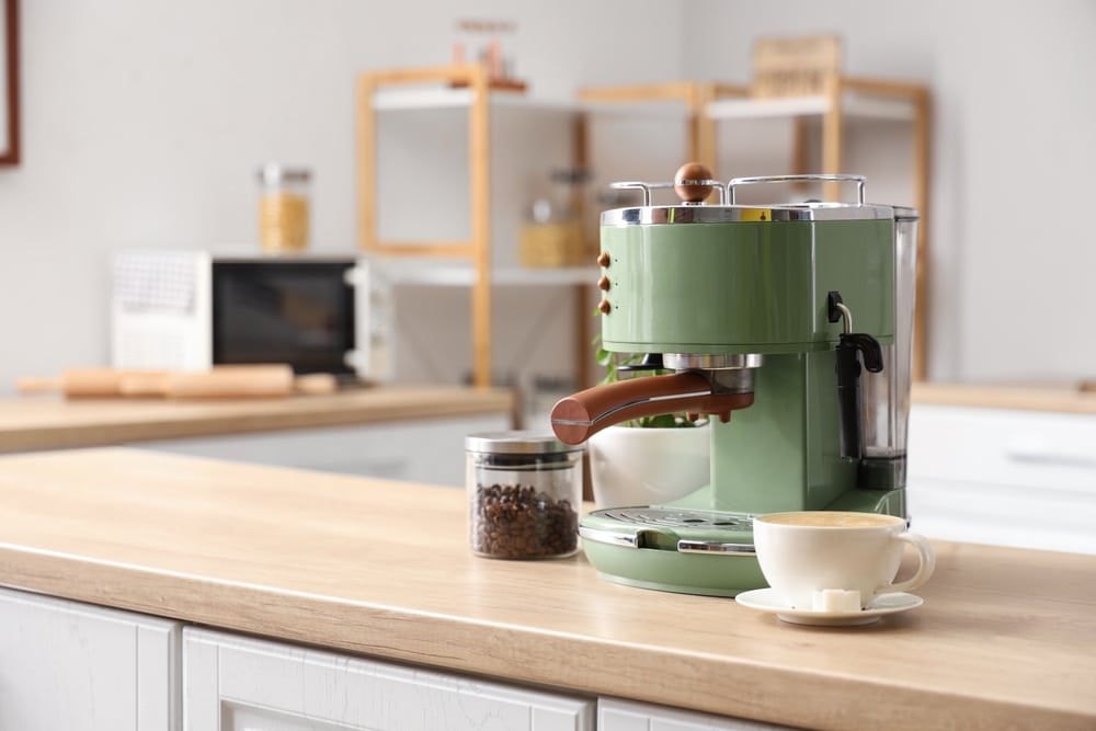 Modern Coffee Machine Beans And Cup Of Espresso On Wooden