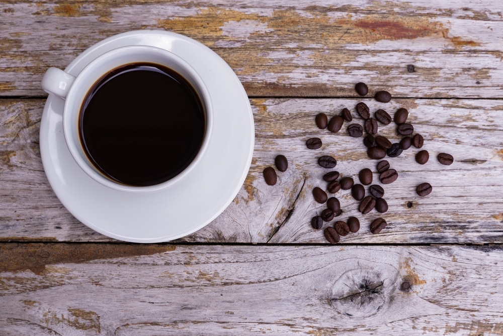 Hot Americano Coffee On An Old Wooden Table A Cup