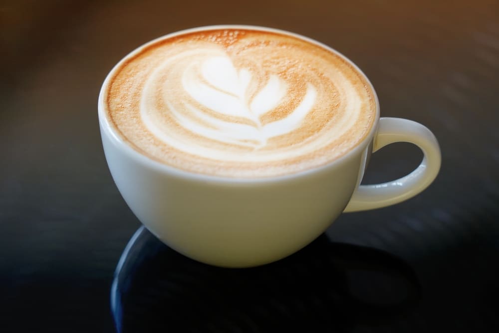 Latte Art Coffee In A White Ceramic Coffee Mug 