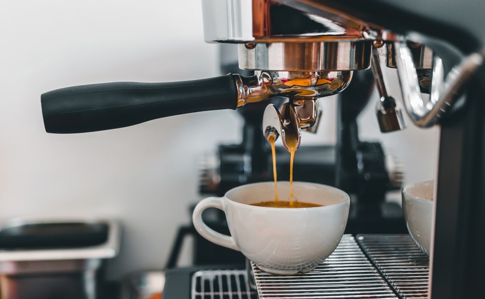 Coffee Extraction From The Coffee Machine With A Portafilter Pouring