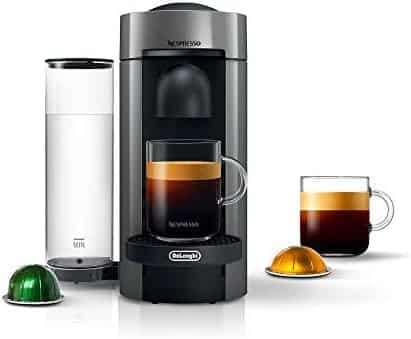 nespresso vertuoplus machine with coffee pods and a cup of coffee