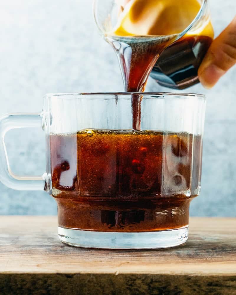 pouring Red Eye Coffee Cocktail in a coffee cup