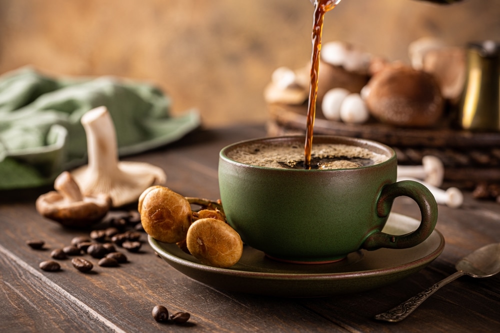 Trendy Superfood Mushroom Coffee Is Pouring In Green Cup On