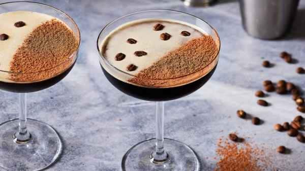 two glass of Chocolate Coffee Martini garnished with coffee powder and coffeee beans