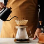 Men Barista Making A Drip Coffee Pouring Hot Water From