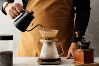 Men Barista Making A Drip Coffee Pouring Hot Water From